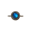 Silver ring with a blue gemstone on a white background